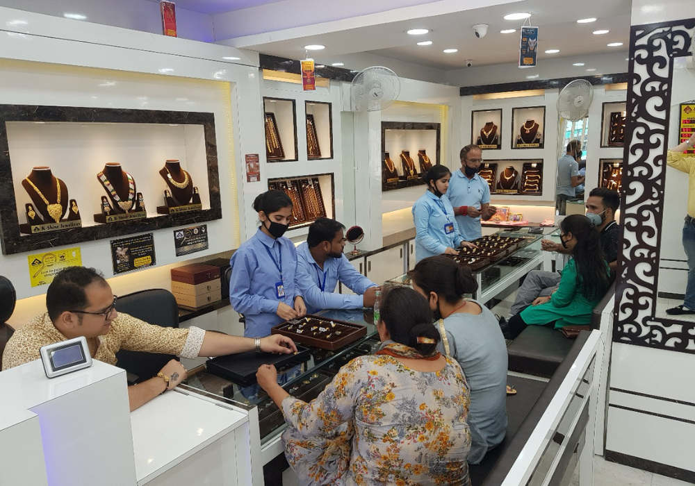 Customers purchasing gold at K-Shine Jewellers Janipur Jewellery showroom